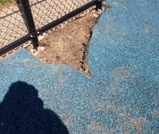 Big holes in poured in can be patched with a poured in place repair kit.