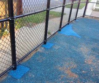 Fix holes in playground surface with poured in repair kits.