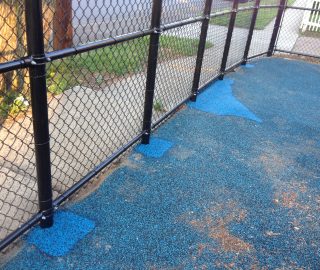 Fix holes in playground surface with poured in repair kits.