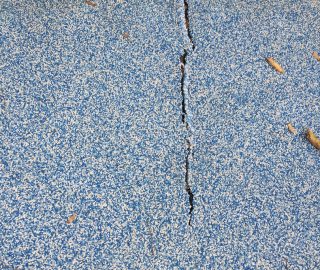 Repair cracks in your poured in with DIY playground surface repair kits.
