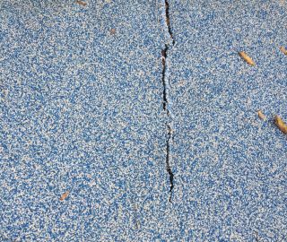 Repair cracks in your poured in with DIY playground surface repair kits.