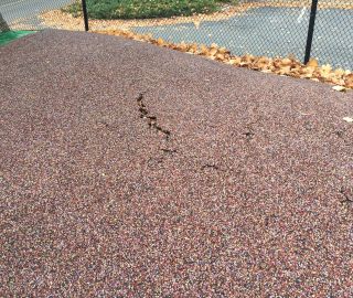 Playground surface crack prior to repair.