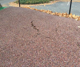 Playground surface crack prior to repair.