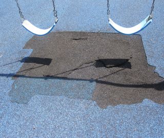 This whole area can be patched with a rubber playground patch kit.