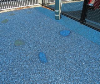 Playground surface hole repair.