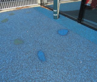 Playground surface hole repair.
