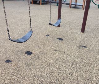 Fix playground surface damage.
