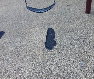 A playground rubber repair kit can easily fix this hole.