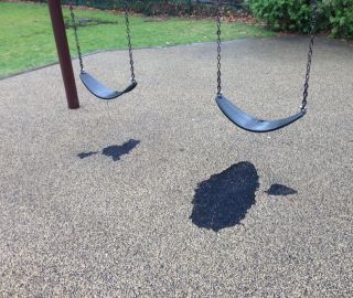 Damage under swings due to high traffic can be fixed with DIY playground surface repair.
