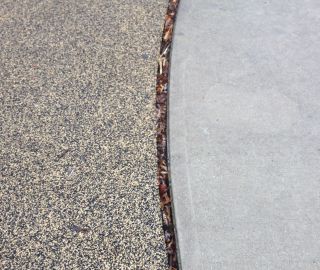 Playground safety surfacing will shrink over time.