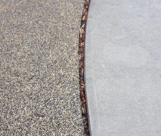Playground safety surfacing will shrink over time.