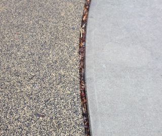 Playground safety surfacing will shrink over time.