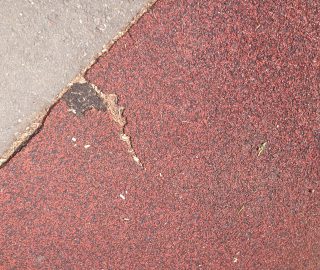 Easily fixed with a patch via our poured in place repair kits.