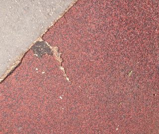 Easily fixed with a patch via our poured in place repair kits.