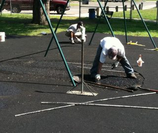 Playground surface base layer installation.
